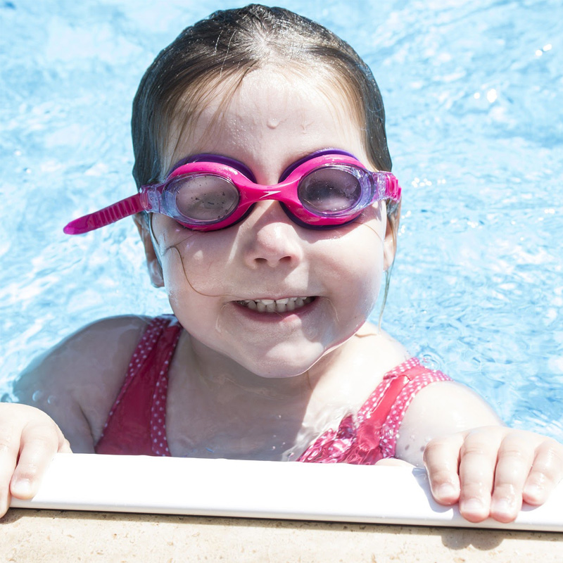 girl smiling from pool